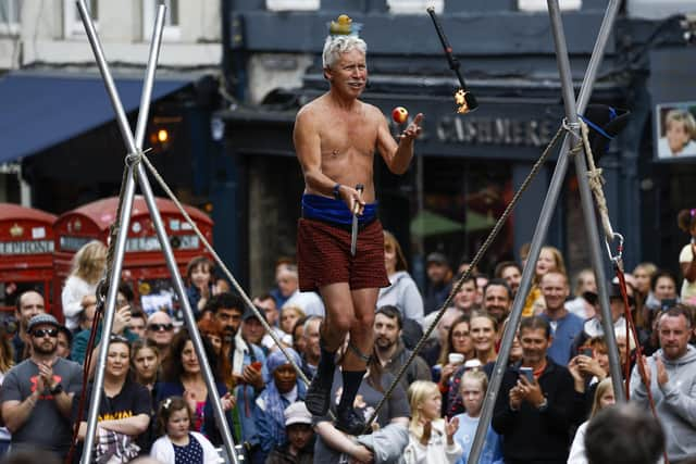 A street entertainer performs on Edinburgh's Royal Mile during the city's Festival Fringe. Picture: Jeff J Mitchell/Getty Images