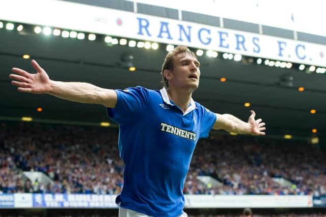 Nikica Jelavic celebrates an opening goal for Rangers against Hearts