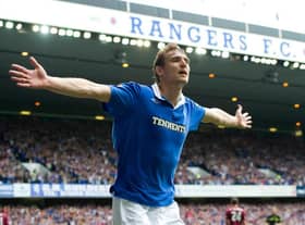 Nikica Jelavic celebrates an opening goal for Rangers against Hearts