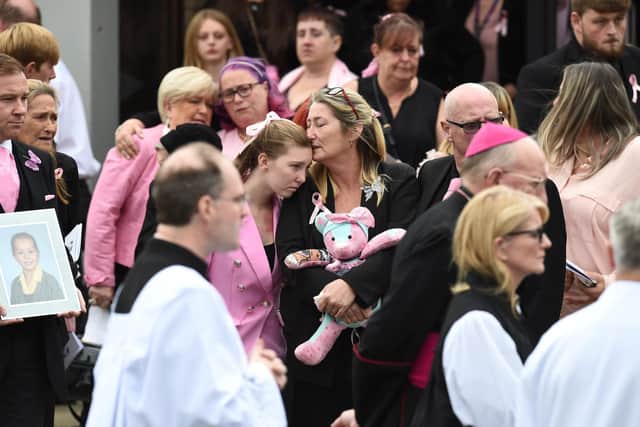 Olivia's mother Cheryl Korbel (centre) leaves St Margaret Mary's Church in Knotty Ash, Liverpool, following the funeral for her daughter. Picture: Peter Powell/PA Wire