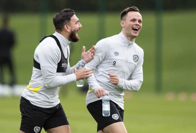 Robert Snodgrass and Lawrence Shankland share a laugh during training ahead of Hearts' match against Fiorentina.