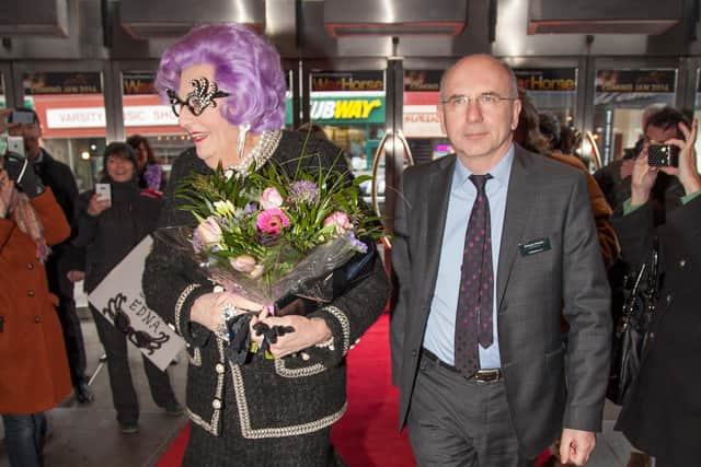 Escorting Dame Edna Everage through the crowds