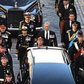 King Charles III, flanked by Princess Anne, Prince Andrew, and Prince Edward walk behind the procession of Queen Elizabeth II's coffin, from the Palace of Holyroodhouse to St Giles Cathedral, on the Royal Mile in Edinburgh (Picture: Oli Scarff/AFP via Getty Images)