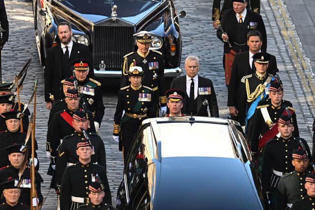 King Charles III, flanked by Princess Anne, Prince Andrew, and Prince Edward walk behind the procession of Queen Elizabeth II's coffin, from the Palace of Holyroodhouse to St Giles Cathedral, on the Royal Mile in Edinburgh (Picture: Oli Scarff/AFP via Getty Images)