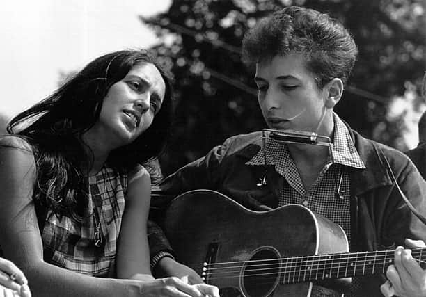 Bob Dylan, seen with Joan Baez in 1963, repurposed the ballad Lord Randal to write A Hard Rain’s A-Gonna Fall (Picture: Rowland Scherman/National Archive/Newsmakers/Getty Images)