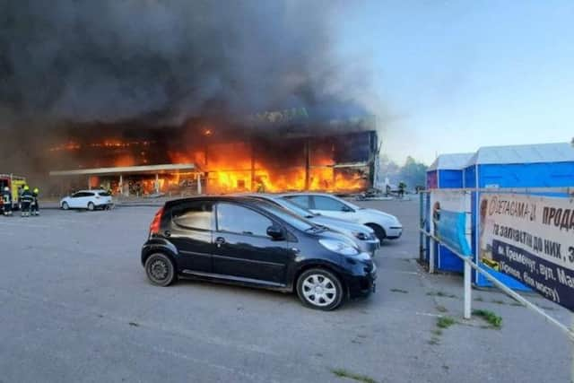 Firefightersbattle a blaze in a mall hit by a Russian missile strike in the eastern Ukrainian city of Kremenchuk, killing at least two and injuring dozens more, Ukraine's President said.