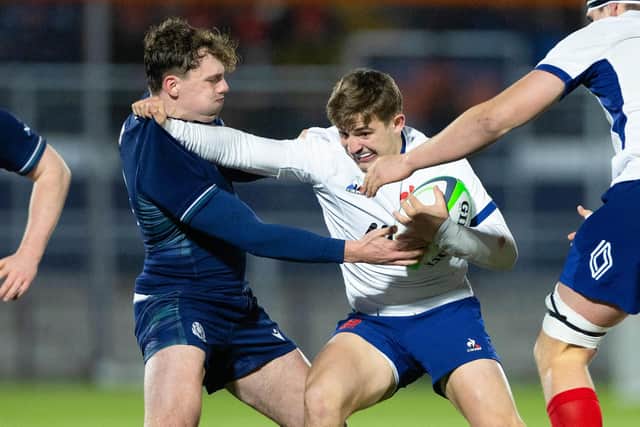 Scotland's Geordie Gwynn challenges France's Xan Mousques during an Under-20's Six Nations match at Hive Stadium, on February 09, 2024. (Photo by Ewan Bootman / SNS Group)