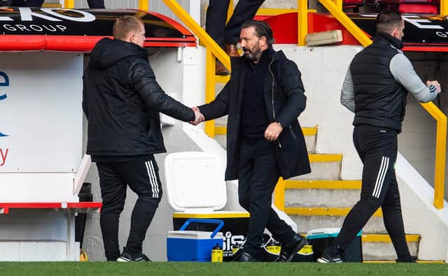 Aberdeen manager Derek McInnes shakes hands with Neil Lennon at full-time. Picture: SNS