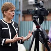 First Minister Nicola Sturgeon speaks to the media during her visit to Buchanan Street Residential Children's Home in Coatbridge. Picture: Andrew Milligan/PA Wire