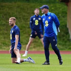 Scotland head coach Steve Clarke with Ryan Porteous (centre) during a training session at Stadion am Groben in Garmisch-Partenkirchen, Germany. Picture date: Sunday June 16, 2024.