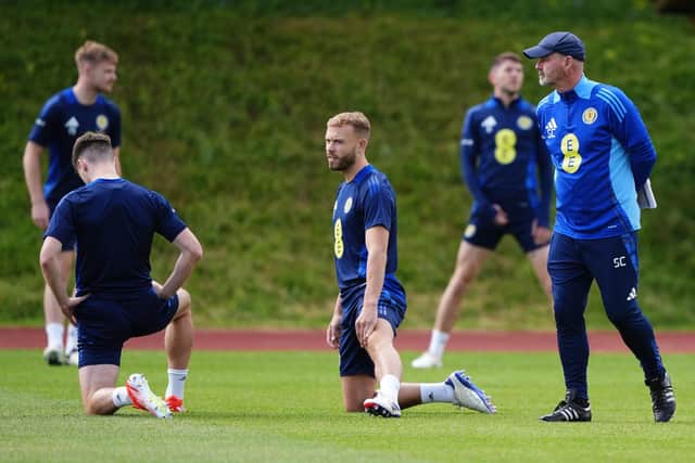 Scotland head coach Steve Clarke with Ryan Porteous (centre) during a training session at Stadion am Groben in Garmisch-Partenkirchen, Germany. Picture date: Sunday June 16, 2024.