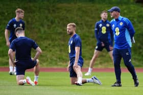 Scotland head coach Steve Clarke with Ryan Porteous (centre) during a training session at Stadion am Groben in Garmisch-Partenkirchen, Germany. Picture date: Sunday June 16, 2024.