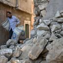 A man walks past destroyed homes in the mountain village of Moulay Brahim in the central province of al-Haouz. Picture: AFP via Getty Images