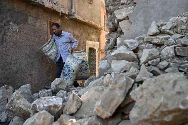 A man walks past destroyed homes in the mountain village of Moulay Brahim in the central province of al-Haouz. Picture: AFP via Getty Images