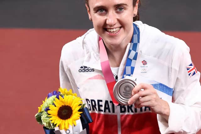 Laura Muir shows off her silver medal after her stunning run in the Olympic women's 1500m in Tokyo. Picture: Ryan Pierse/Getty Images