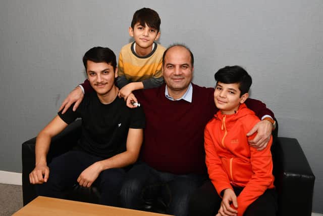Sayed Zaman Hashemi and his family - Ramin Hashemi 17; Masih Hashemi 8; and Shahyad Hashemi 13 - who have fled from the Taliban in Afghanistan and are currently in Perth. Picture: Michael Gillen