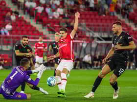 Dundee United goalkeeper Mark Birighitti tries to stop AZ Alkmaar's Milos Kerkez during a chastening night for the Scottish team.