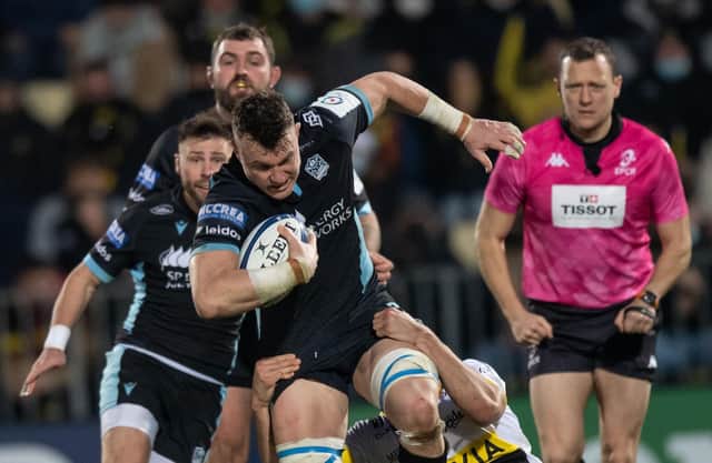 Glasgow's Jack Dempsey runs with the ball during the European Rugby Champions Cup clash with La Rochelle.
