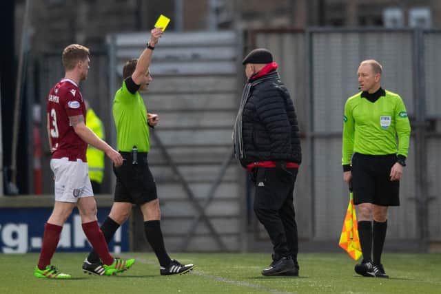 Arbroath manager Dick Campbell is booked for complaining about the Raith Rovers goal.
