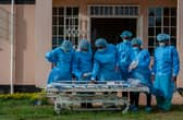 Medical staff dressed in personal protective equipment prepare to go to work in the main Covid-19 treatment centre at Kamuzu Central Hospital in Lilongwe, Malawi (Picture: Amos Gumulira/AFP via Getty Images)
