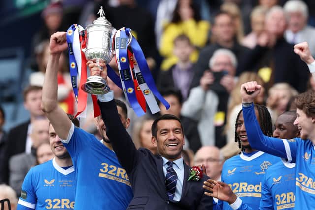 Giovanni van Bronckhorst celebrates his first trophy success as Rangers manager as he holds aloft the Scottish Cup at Hampden. (Photo by Ian MacNicol/Getty Images)
