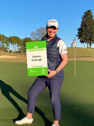 Gemma Dryburgh shows off her LPGA Tour card after finishing joint-22nd in the eight-round Q-Series in Alabama