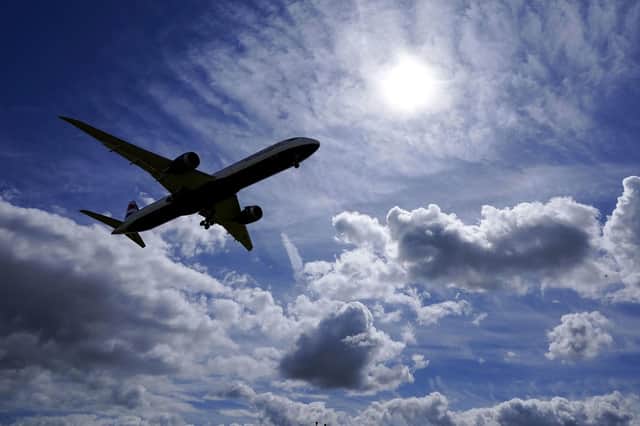 A plane flies in to land. US and EU travellers who are fully vaccinated against coronavirus will be allowed to enter England and Scotland without the need to quarantine from Monday. Picture: Steve Parsons/PA Wire