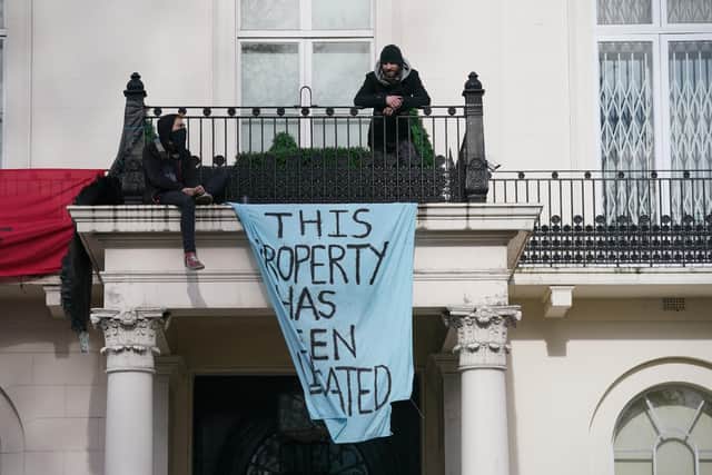 Squatters occupying a mansion belonging to Russian oligarch Oleg Deripaska in Belgrave Square, central London. Mr Deripaska, who has stakes in energy and metals company En+ Group, is one of the seven Russian oligarchs with business empires, wealth and connections that are closely associated with the Kremlin who have been sanctioned by the UK Government. Picture date: Monday March 14, 2022.