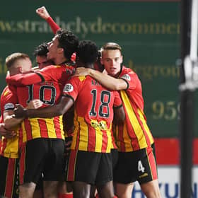 Partick Thistle's players celebrate a fine win.
