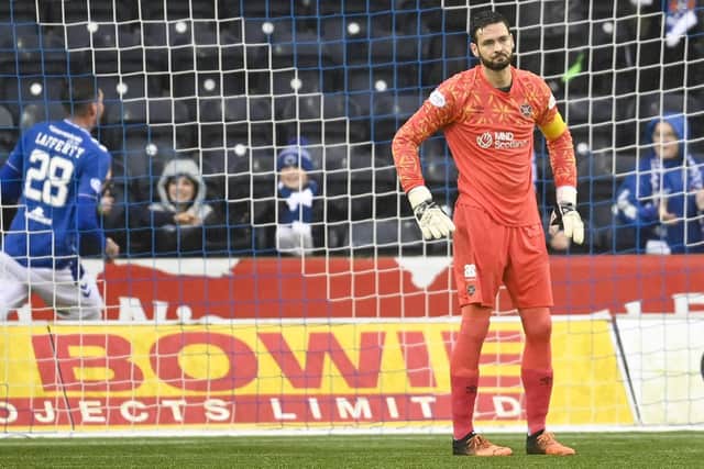 Craig Gordon looks dejected after the Hearts goalkeeper was dispossessed by Kilmarnock's Kyle Lafferty.