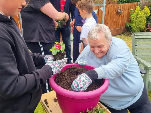 Residents at HC-One Scotland’s Highgate Care Home and children Tannockside Primary School gardening