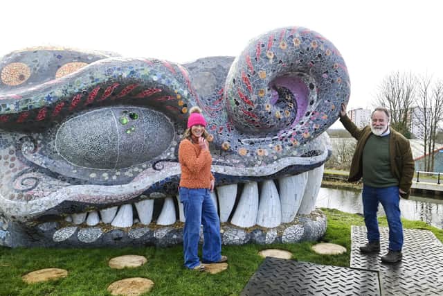Artists Ruth Impey and Nichol Wheatley beside the completed head of Bella The Beithir which they created, at its unveiling on March 1 beside Stockingfield Bridge on the Forth & Clyde Canal in Glasgow. (Photo by John Devlin/The Scotsman)