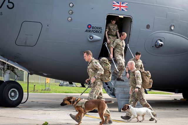 Military personnel and military working dogsarrive back in the UK from Afghanistan