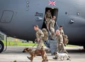 Military personnel and military working dogsarrive back in the UK from Afghanistan