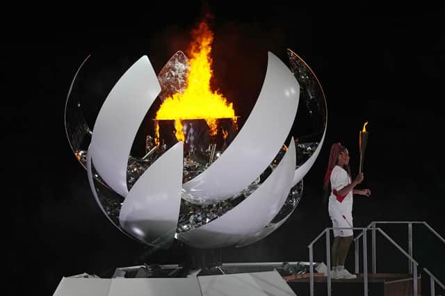 Tennis superstar Naomi Osaka lit the flame to signify the start of Tokyo's Olympics