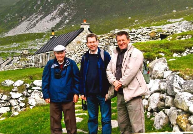 Murdo, middle, and his brother Alexander (right) with their father on a trip to St Kilda to mark his 80th birthday in 2009.