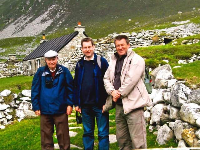 Murdo, middle, and his brother Alexander (right) with their father on a trip to St Kilda to mark his 80th birthday in 2009.