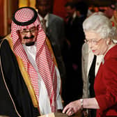 Queen Elizabeth with Saudi Arabia's former King Abdullah, who she once drove around Balmoral at a time when women in his kingdom were not allowed to drive (Picture: Akira Suemori/AFP via Getty Images)