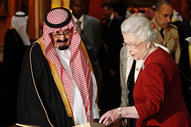 Queen Elizabeth with Saudi Arabia's former King Abdullah, who she once drove around Balmoral at a time when women in his kingdom were not allowed to drive (Picture: Akira Suemori/AFP via Getty Images)