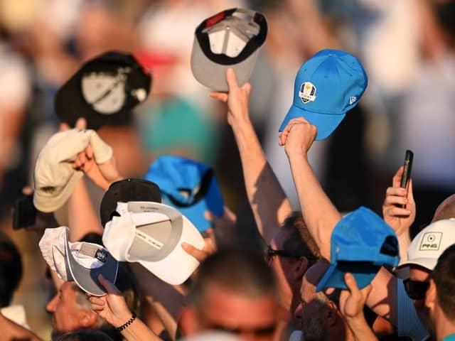 Spectators twirl their hats and caps at Patrick Cantlay during the Saturday afternoon fourball matches in the Ryder Cup in Rome. Picture: Ross Kinnaird/Getty Images.