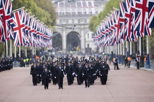 Police officers march along the Mall during the state funeral of Queen Elizabeth II (Picture: Graeme Robertson/WPA pool/Getty Images)