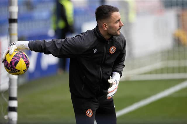 Mark Birighitti is back in Dundee United starting XI.