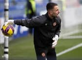 Mark Birighitti is back in Dundee United starting XI.