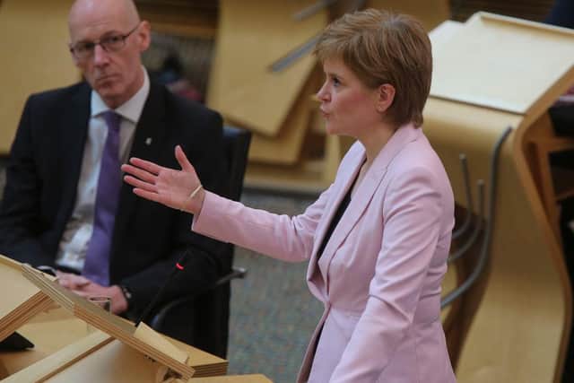 Nicola Sturgeon has urged the public to “bear with us” amid reports of the coronavirus test booking system sending Scots to sites in England. (Photo by Fraser Bremner – Pool/Getty Images)