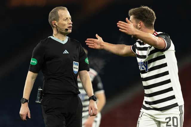 Queen's Park's Jack Turner is unhappy with Willie Collum during the match at Hampden.