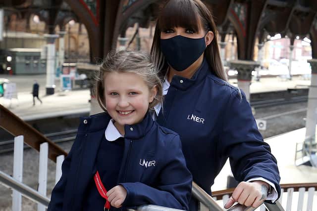 LNER driver Becky Brown and her daughter Maisie at York Station. Picture: Nigel Roddis/PA Wire