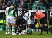Martin Boyle goes down injured during Hibs' win over St Mirren.