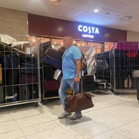 Unattended bags, including some in open cages, in an Edinburgh Airport terminal corridor on Thursday. (Photo by Louise Murray)