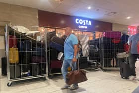 Unattended bags, including some in open cages, in an Edinburgh Airport terminal corridor on Thursday. (Photo by Louise Murray)