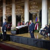 People walk past the coffin of former Soviet President Mikhail Gorbachev inside the Pillar Hall of the House of the Unions during a farewell ceremony in Moscow